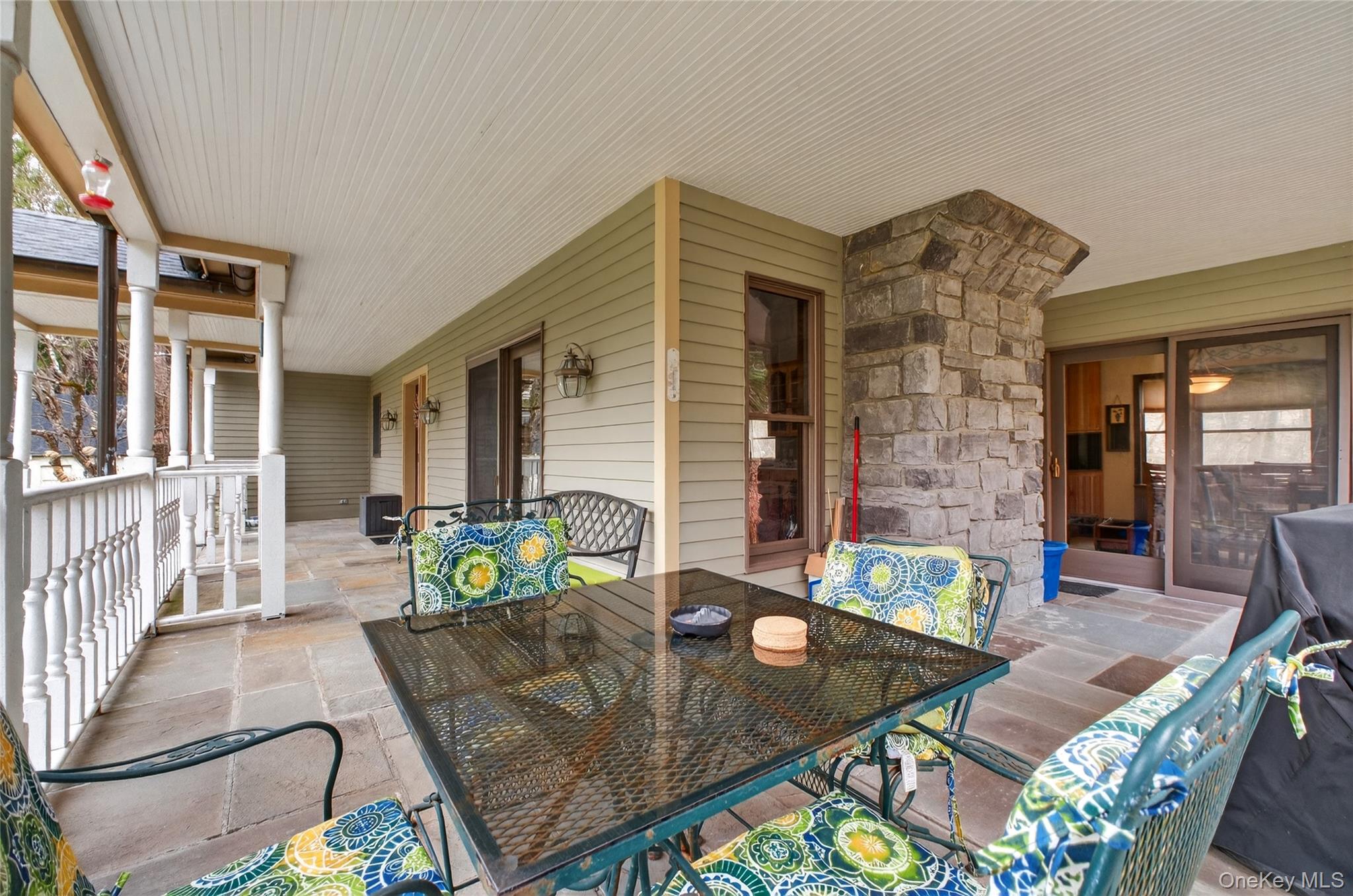 256 Overlook Road Poughkeepsie, NY 12603 - Photo 37 of 47 a view of a patio with couches table and chairs and potted plants