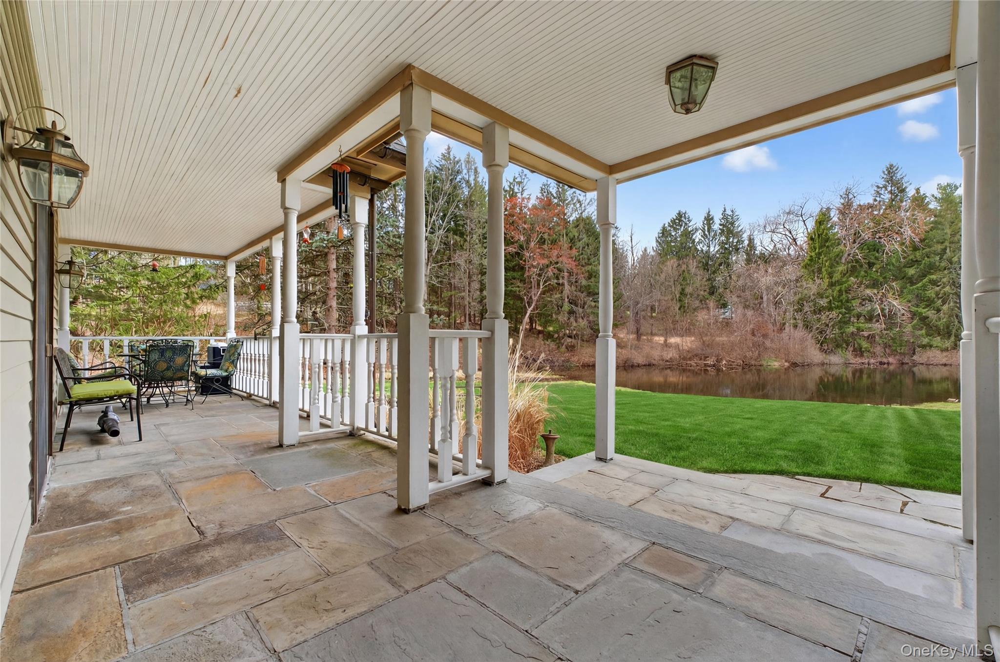 256 Overlook Road Poughkeepsie, NY 12603 - Photo 39 of 47 a view of a porch with furniture and garden