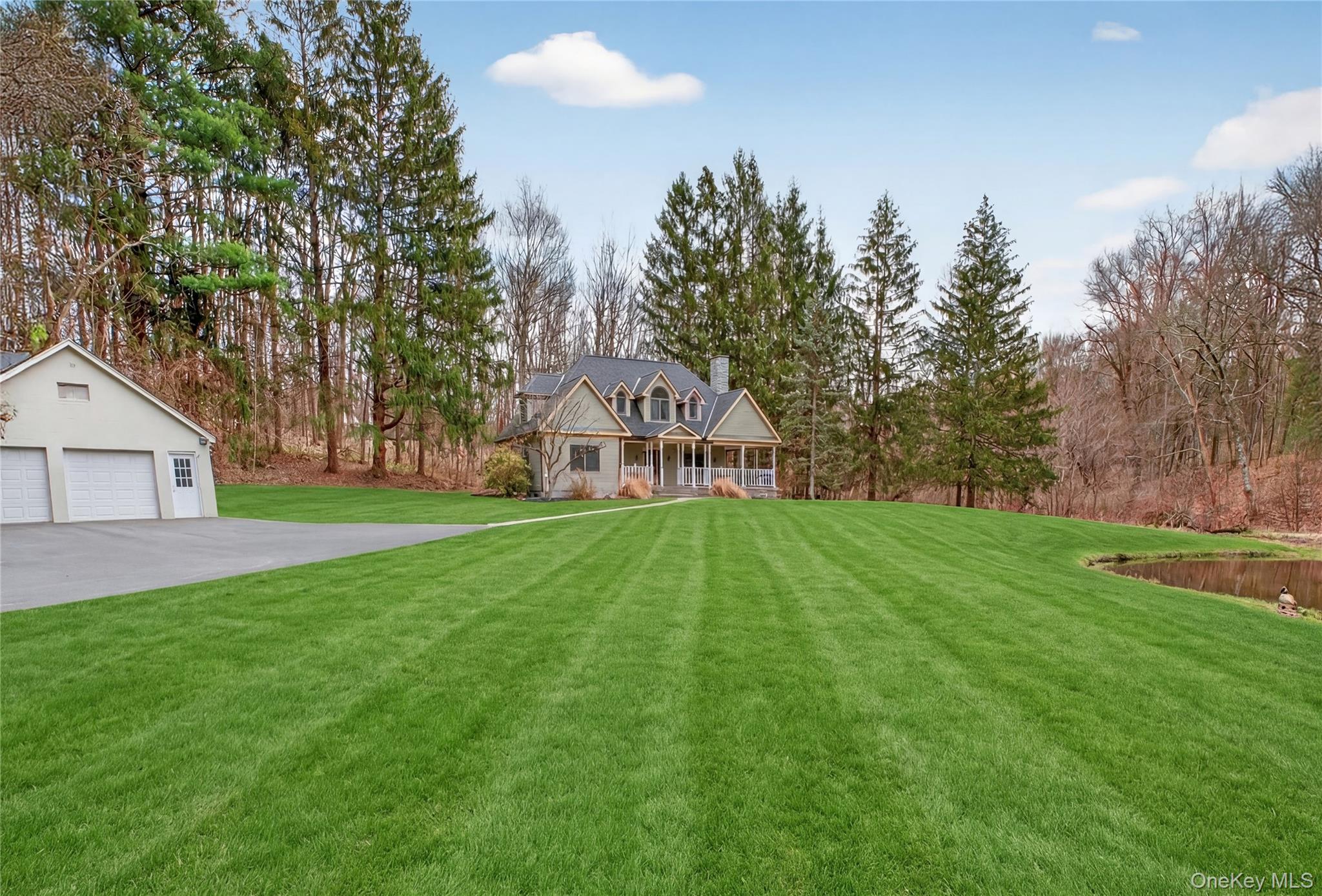 256 Overlook Road Poughkeepsie, NY 12603 - Photo 4 of 47 a view of a house with a yard and sitting area