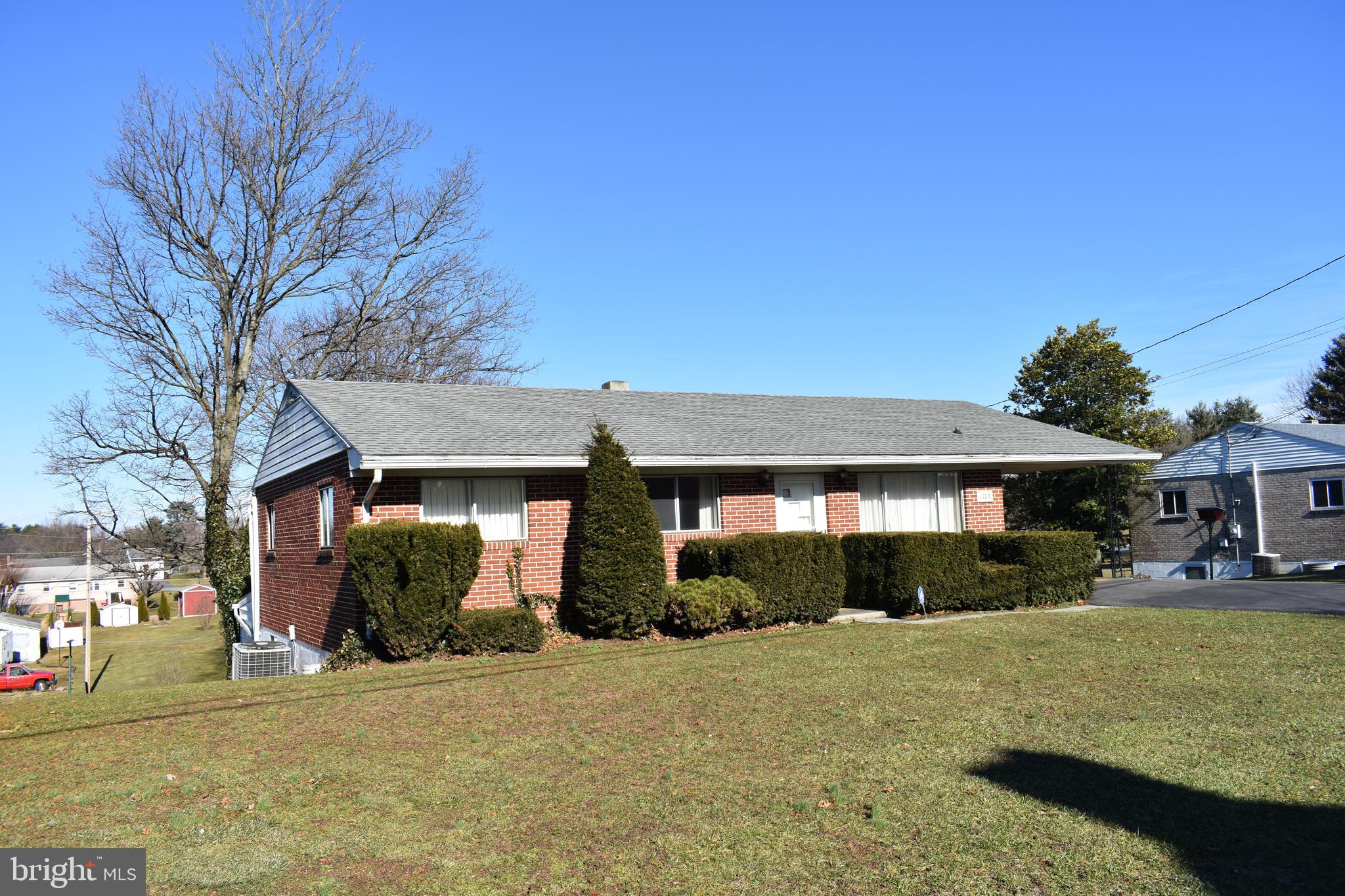 1285 Frank Road Chambersburg, PA 17202 - Photo 3 of 19 a front view of a house with a yard and garage
