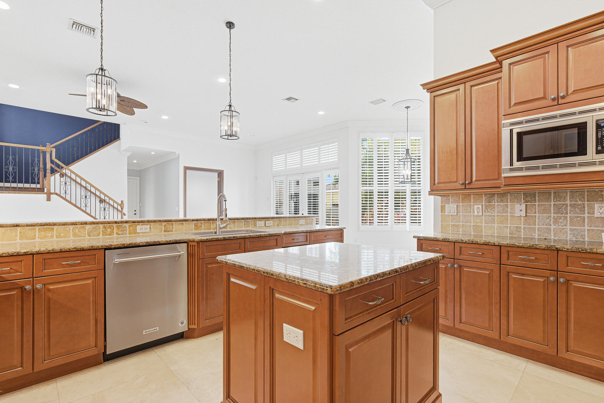 17550 Circle Pond Court Boca Raton, FL 33496 - Photo 19 of 99 a kitchen with stainless steel appliances granite countertop a sink and dishwasher a stove with wooden floor