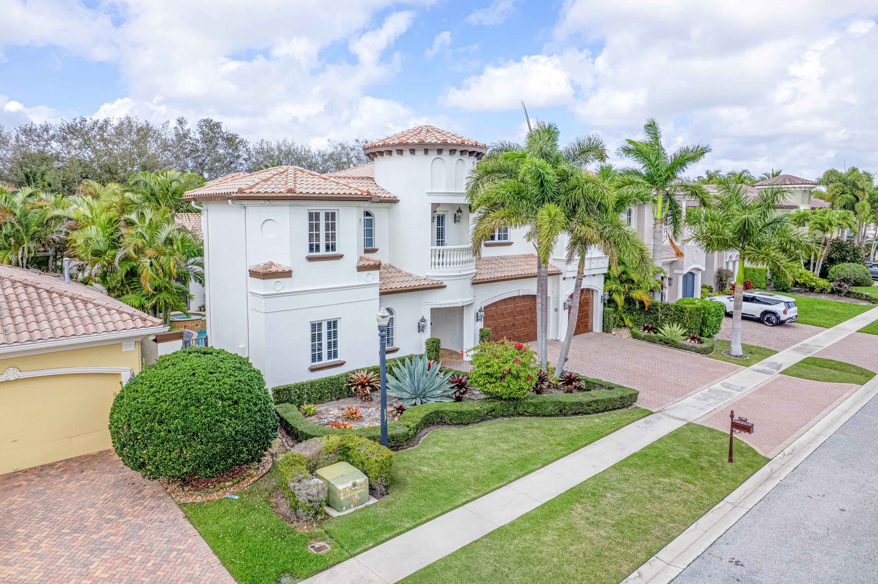 17550 Circle Pond Court Boca Raton, FL 33496 - Photo 2 of 99 a front view of a house with a yard and garage