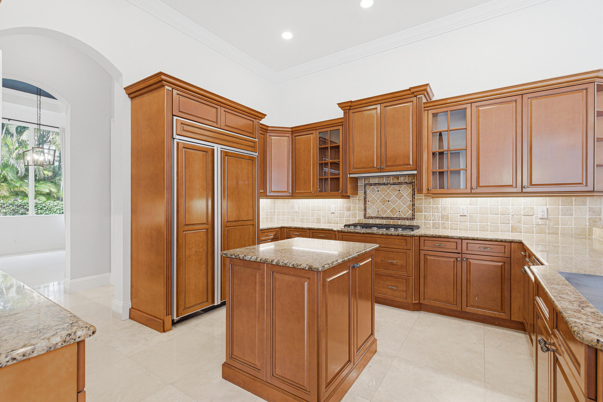 17550 Circle Pond Court Boca Raton, FL 33496 - Photo 23 of 99 a kitchen with stainless steel appliances granite countertop a sink stove and refrigerator