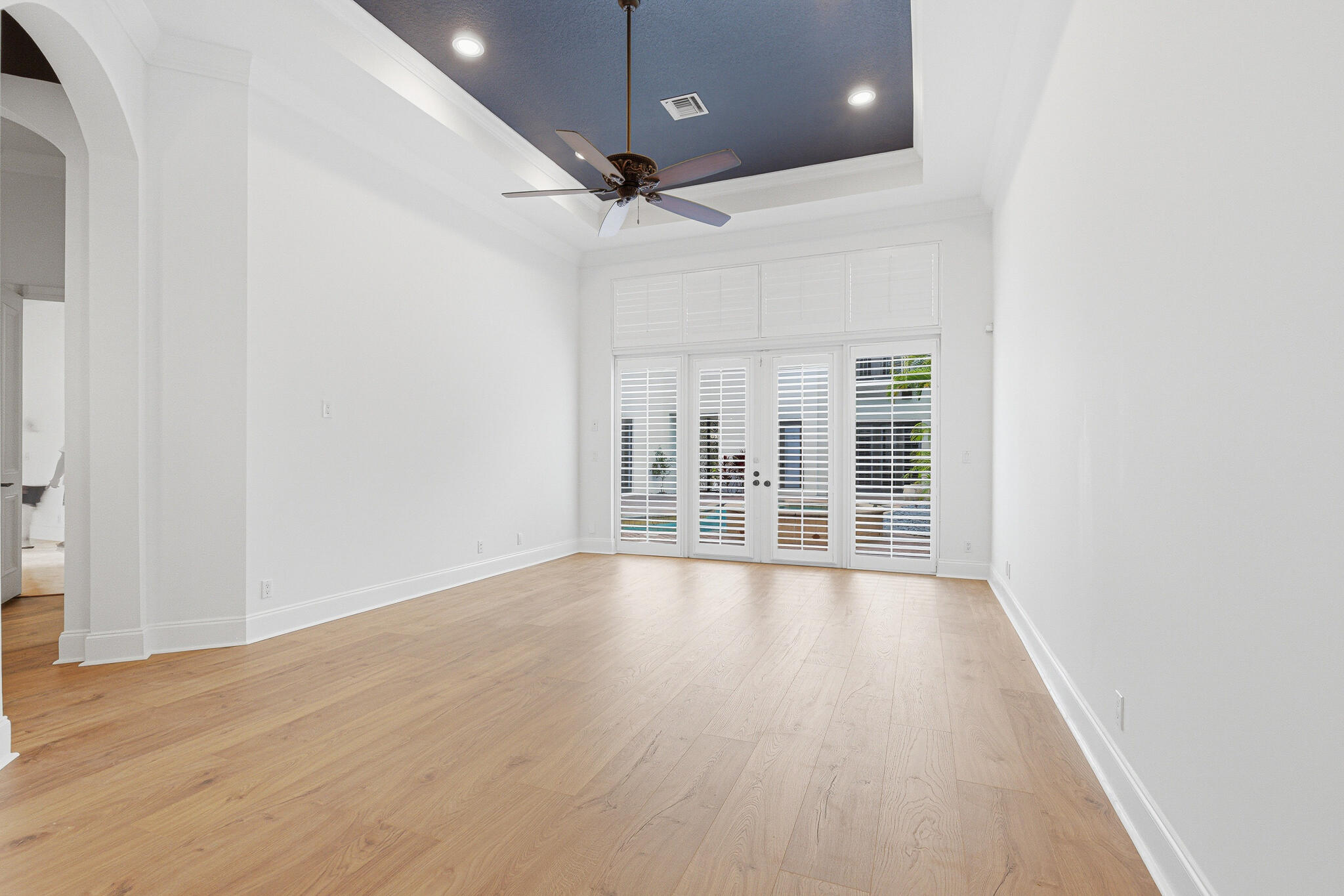 17550 Circle Pond Court Boca Raton, FL 33496 - Photo 32 of 99 an empty room with wooden floor and windows