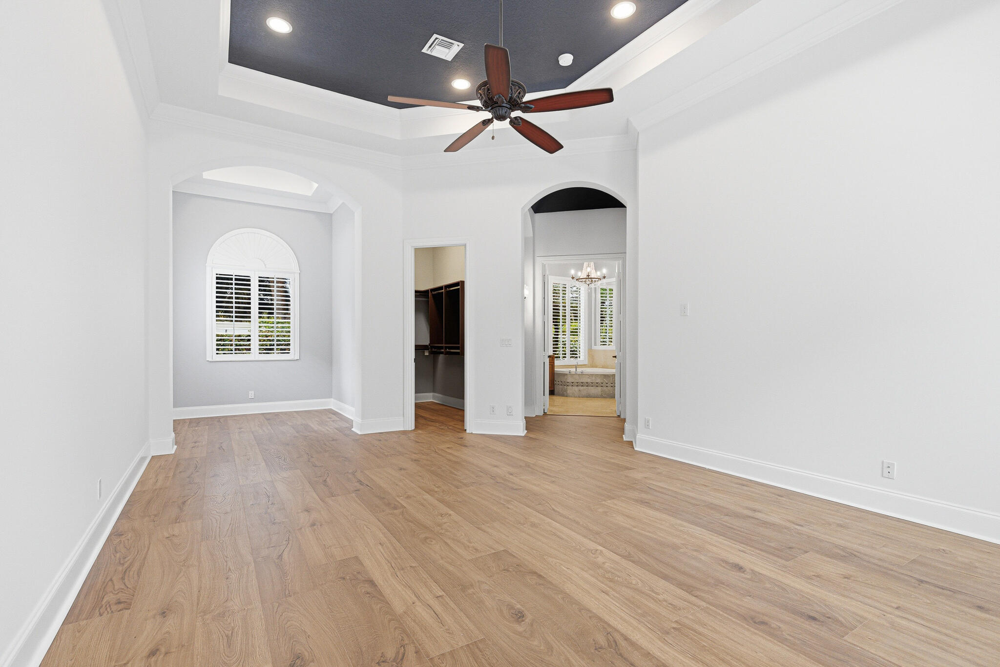 17550 Circle Pond Court Boca Raton, FL 33496 - Photo 36 of 99 an empty room with wooden floor and a ceiling fan