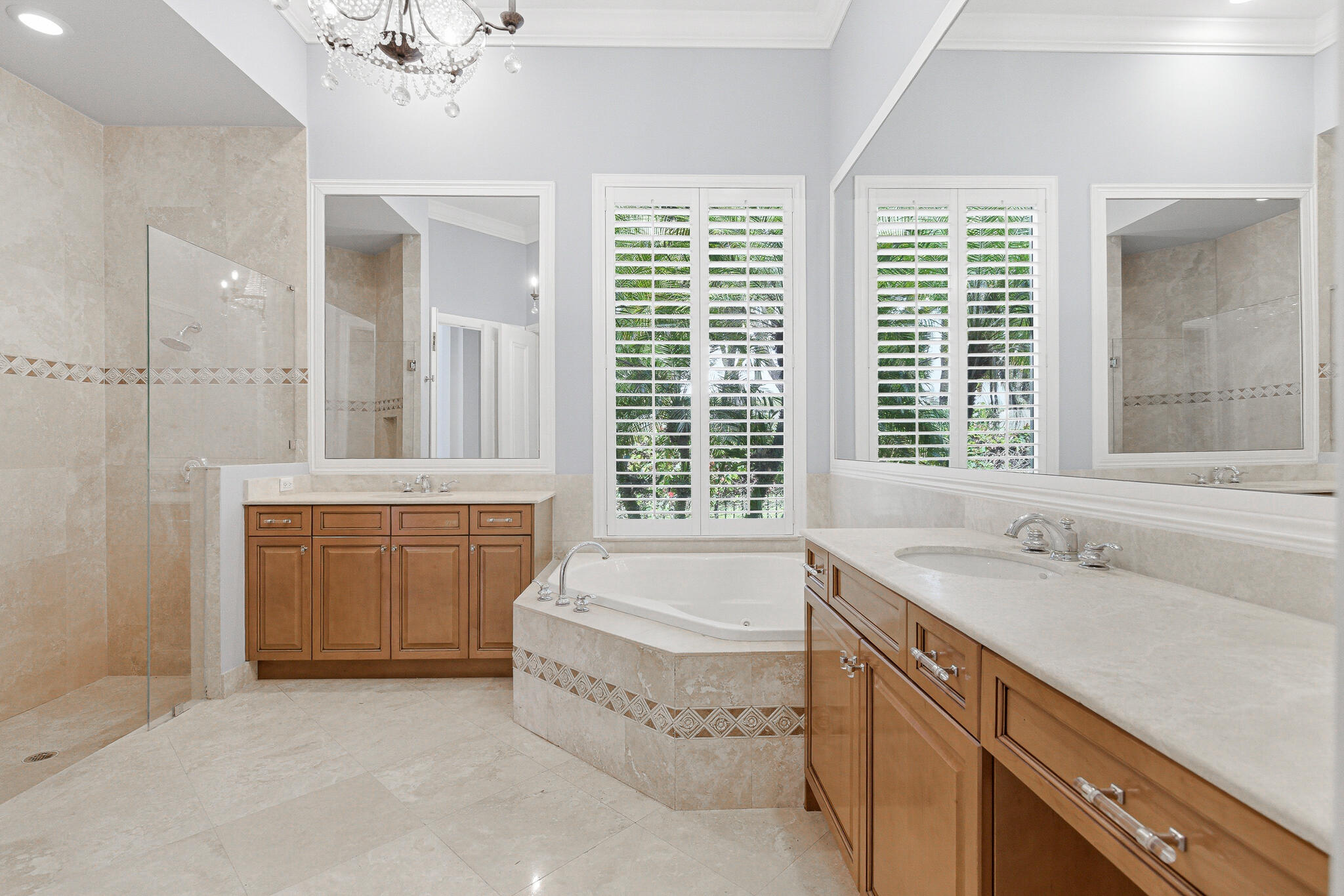 17550 Circle Pond Court Boca Raton, FL 33496 - Photo 39 of 99 a spacious bathroom with a tub a sink and mirror