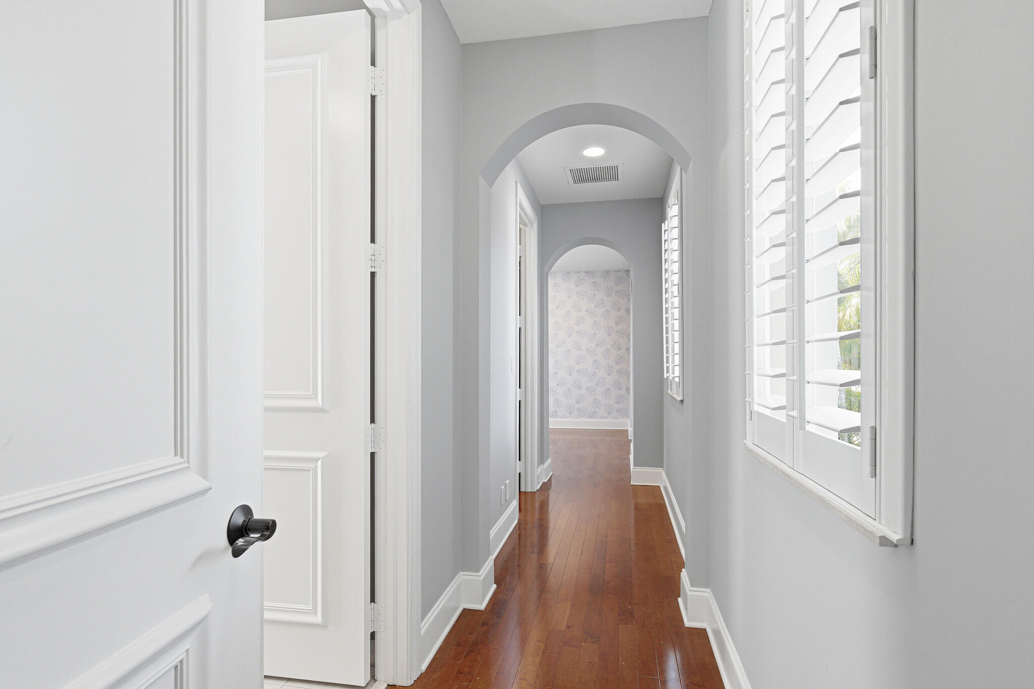 17550 Circle Pond Court Boca Raton, FL 33496 - Photo 54 of 99 a view of a hallway with wooden floor and entryway