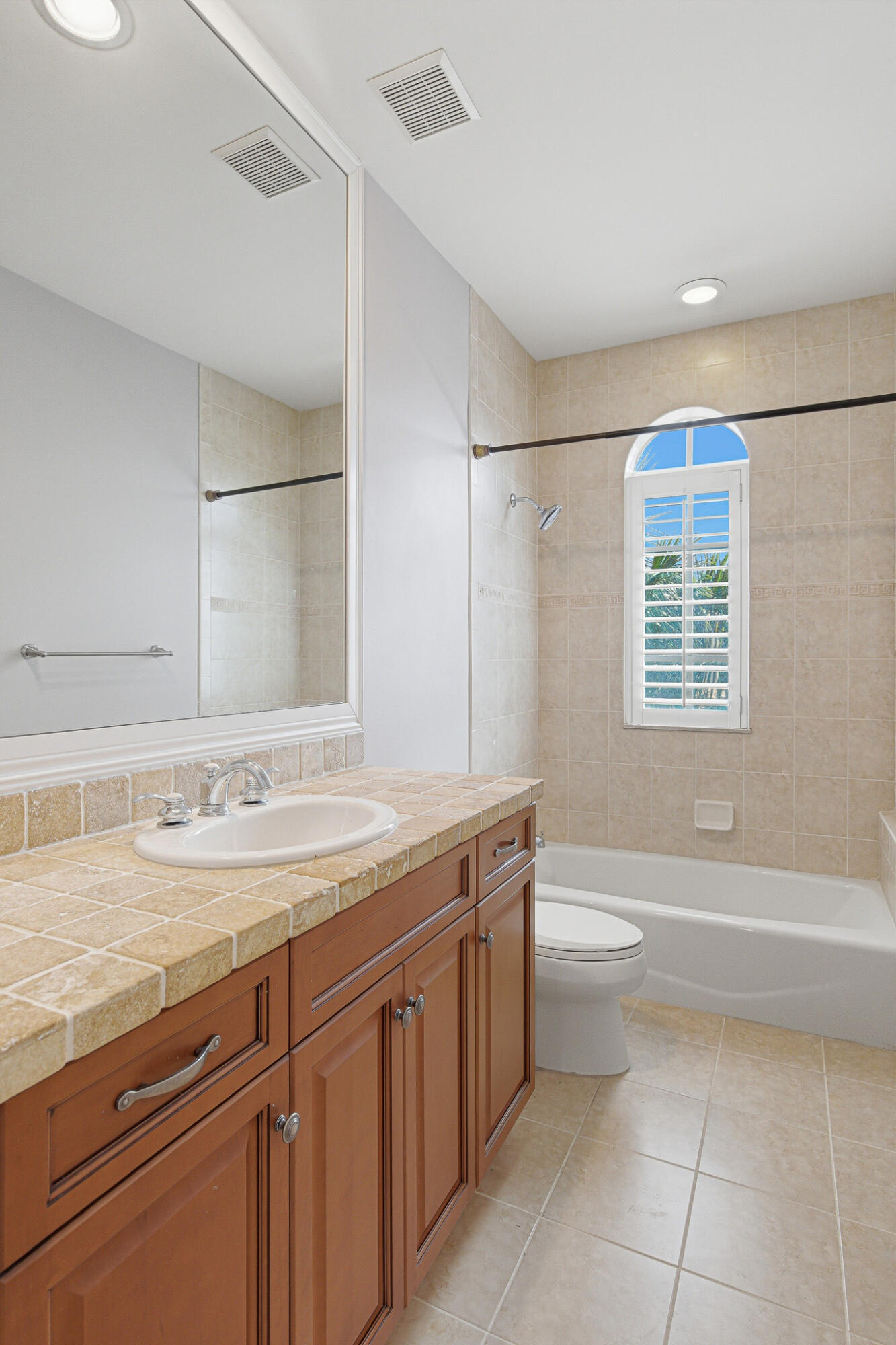 17550 Circle Pond Court Boca Raton, FL 33496 - Photo 59 of 99 a bathroom with a granite countertop sink a toilet and bathtub