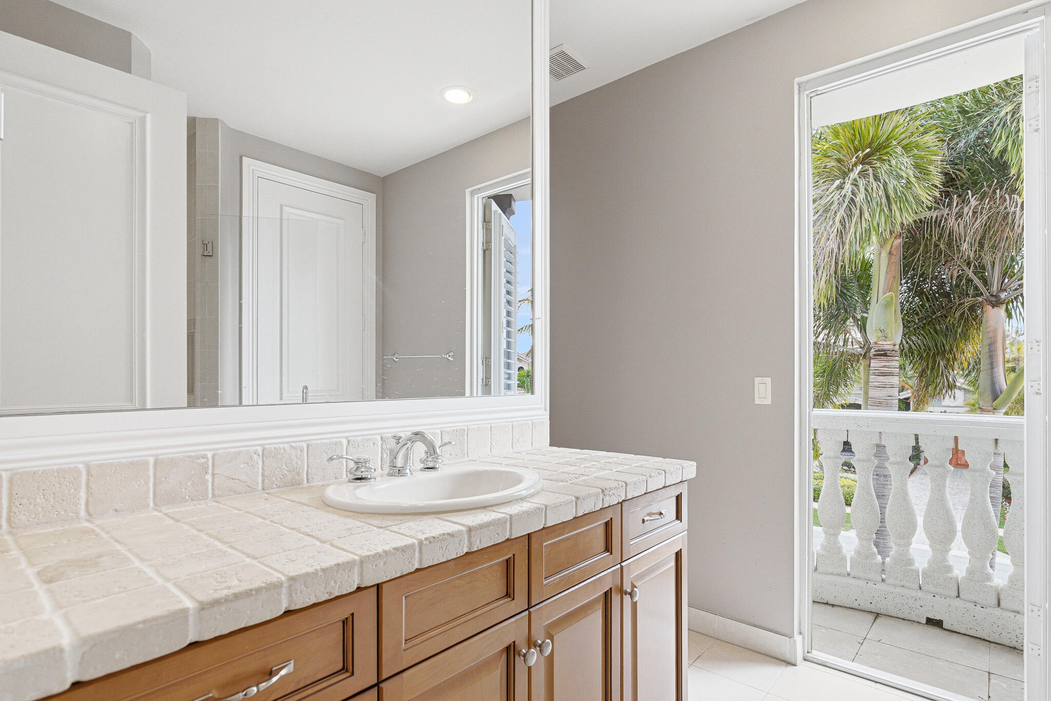 17550 Circle Pond Court Boca Raton, FL 33496 - Photo 64 of 99 a bathroom with a sink and a mirror
