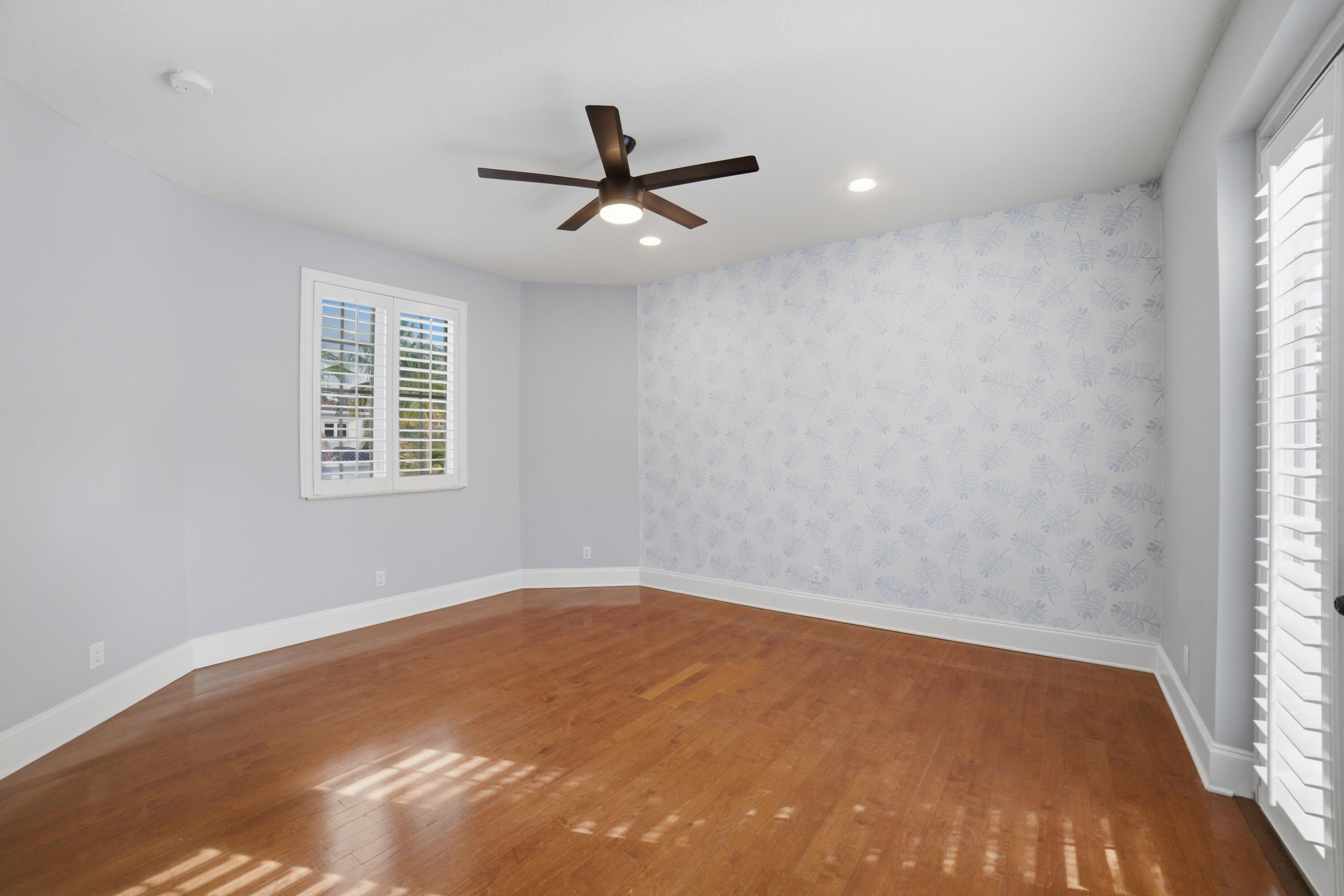 17550 Circle Pond Court Boca Raton, FL 33496 - Photo 66 of 99 an empty room with a window and a ceiling fan