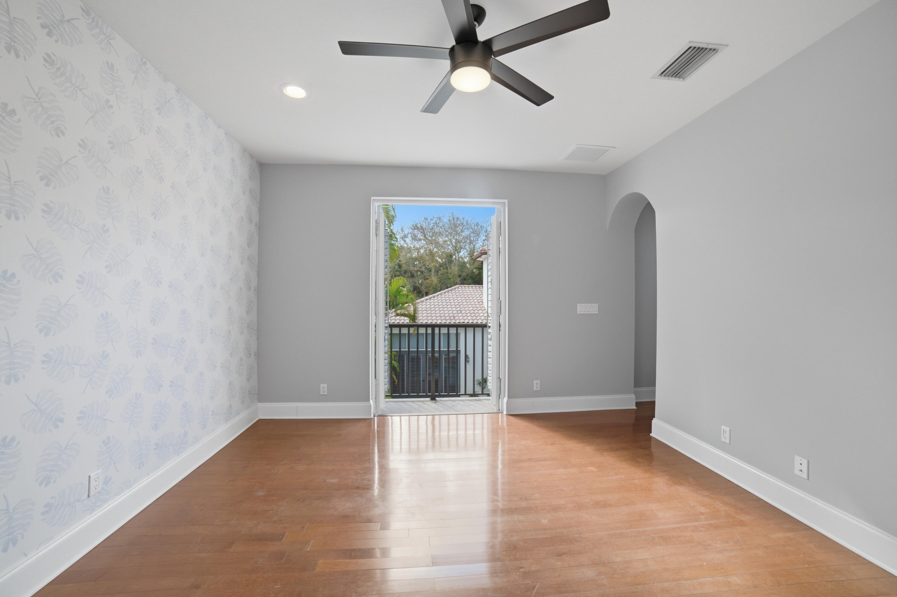 17550 Circle Pond Court Boca Raton, FL 33496 - Photo 69 of 99 an empty room with windows and entrance