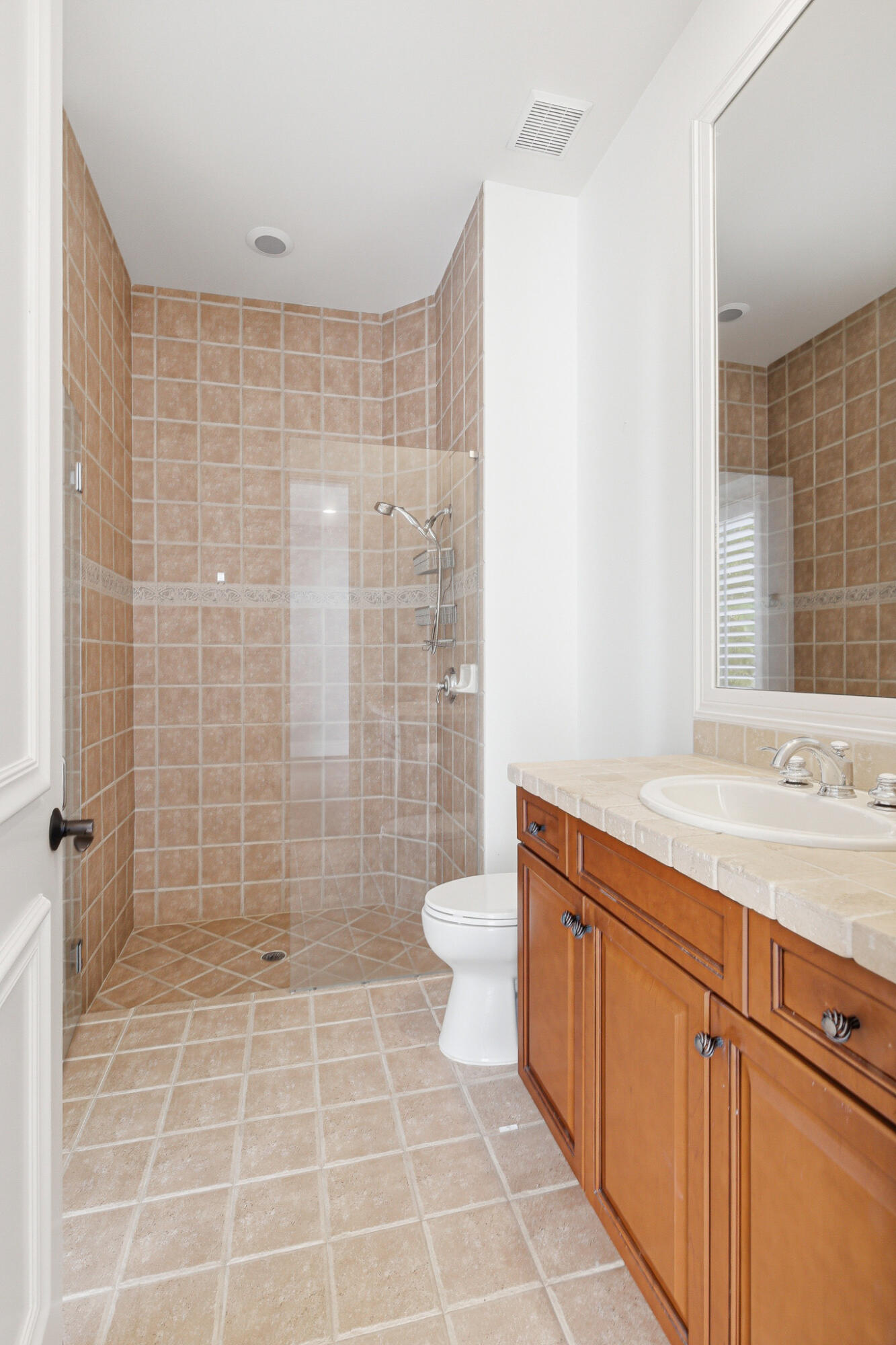 17550 Circle Pond Court Boca Raton, FL 33496 - Photo 72 of 99 a bathroom with a granite countertop toilet a sink a shower and a mirror
