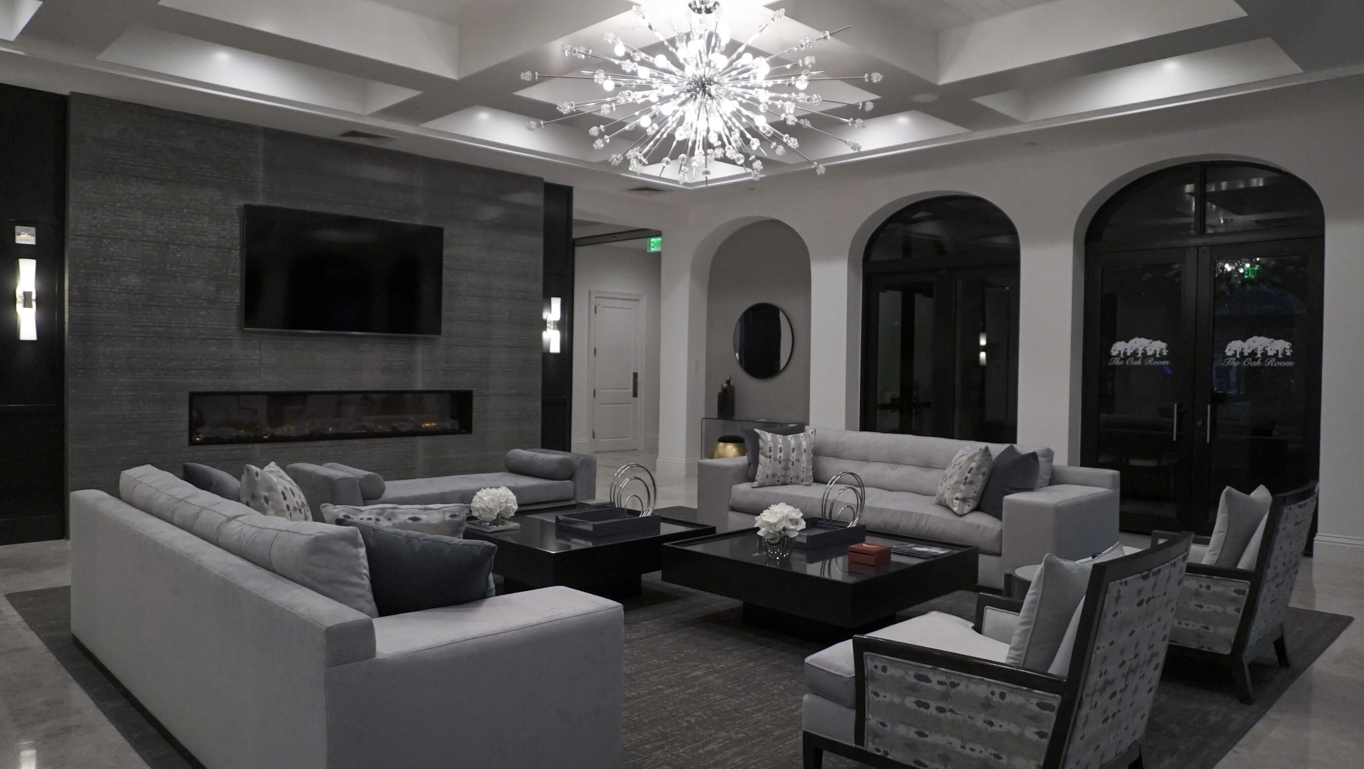 17550 Circle Pond Court Boca Raton, FL 33496 - Photo 91 of 99 a living room with fireplace furniture and a chandelier