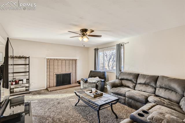 1320 Wooten Road Colorado Springs, CO 80915 - Photo 6 of 26 Cozy fireplace
