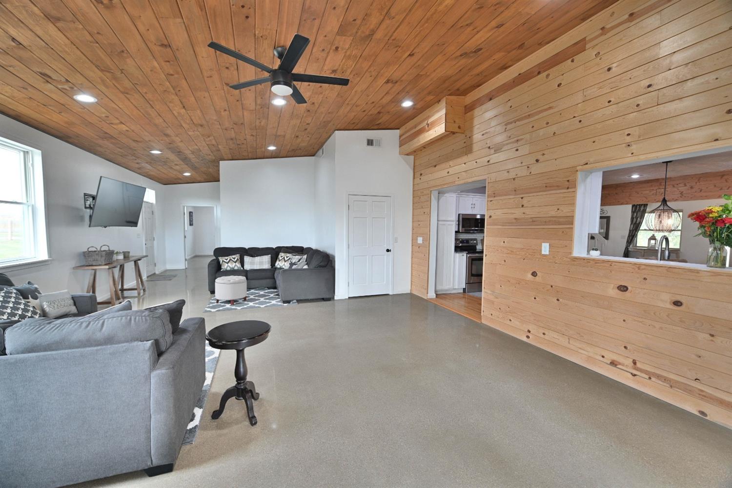 8305 Bocock Road Dillsboro, IN 47018 - Photo 22 of 80 Heated polished concrete flooring with natural wood accents in the new addition: Family room space!
