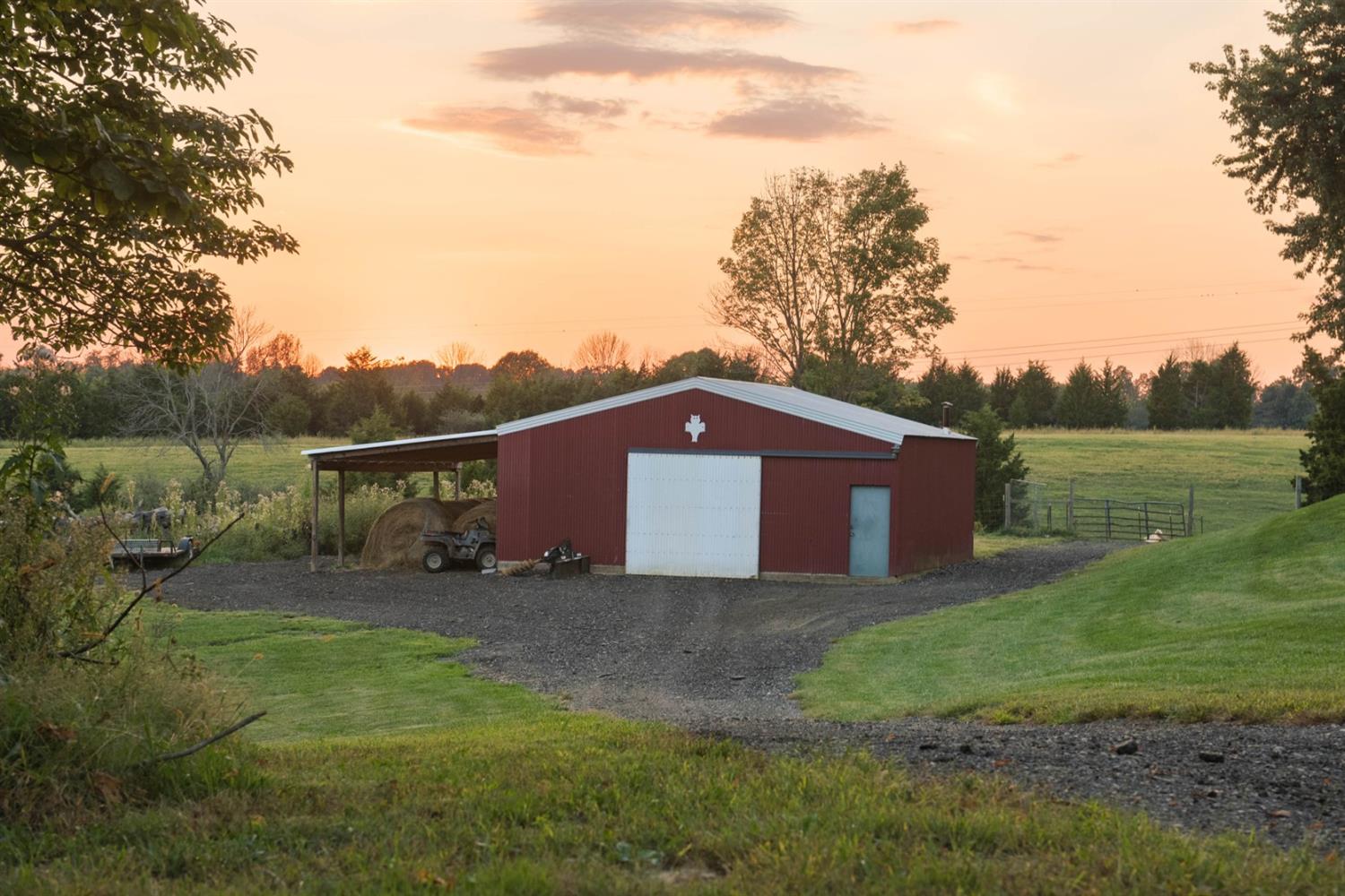 8305 Bocock Road Dillsboro, IN 47018 - Photo 6 of 80 30x30x9 - 10' w x 8.5' h siding door opening - 20'x20' gravel pad inside with a 10' wide L shape treated wood floor boarder floor on left side and along the back floor. Back left corner has a 10x10 platform built 6'7" height under it. 32 x 16 lean to.