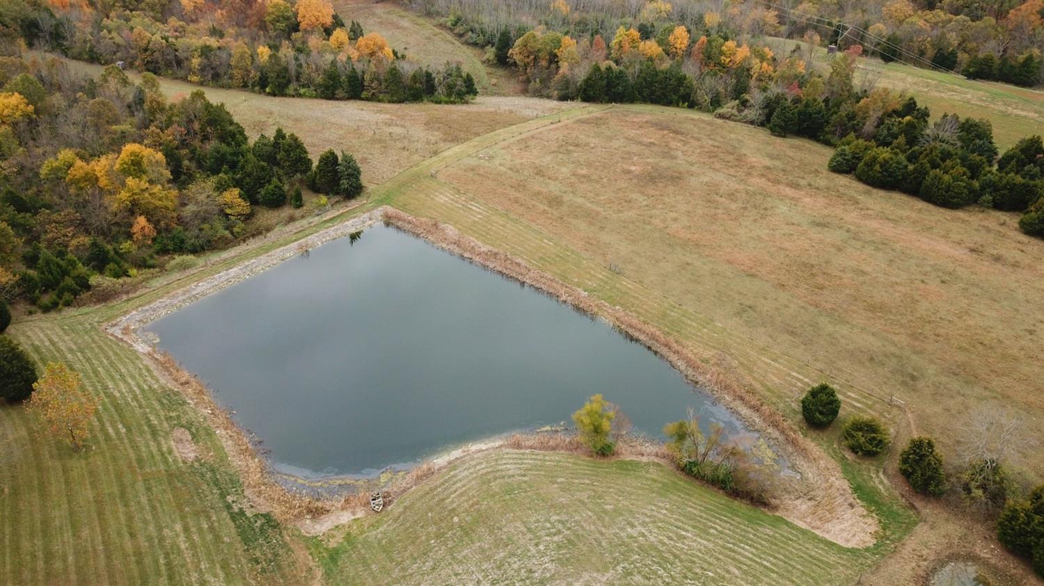 8305 Bocock Road Dillsboro, IN 47018 - Photo 61 of 80 Aerial view of the pond at the end of summer, water was down a bit, but back up now!