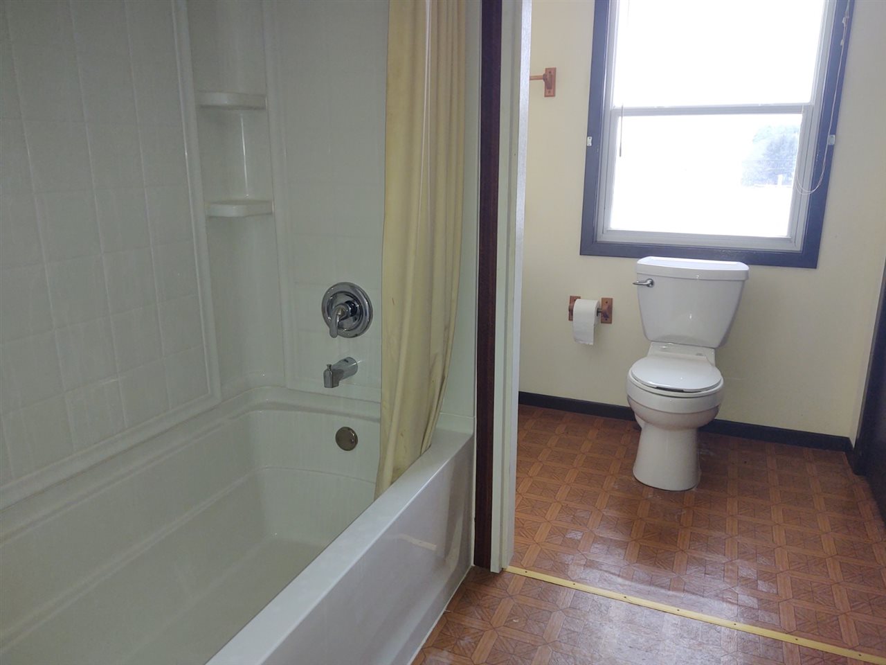 16253 Best Road Davis, IL 61019 - Photo 14 of 25 a bathroom with a toilet sink and a bathtub