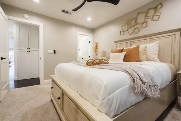 a bedroom with a bed and a walk in closet