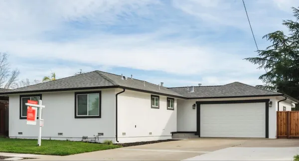 a front view of a house with garden