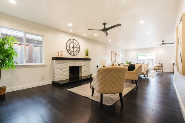 a living room with furniture and a fireplace