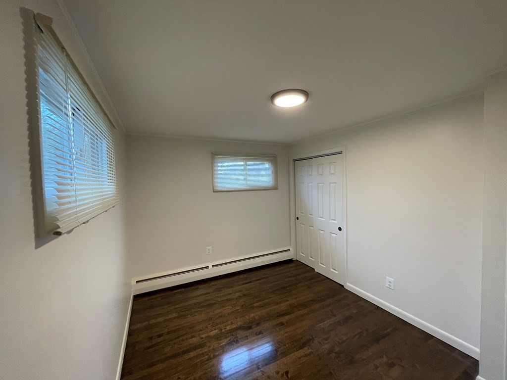40 Dillon Street Worcester, MA 01604 - Photo 14 of 23 a view of a room with wooden floor and window