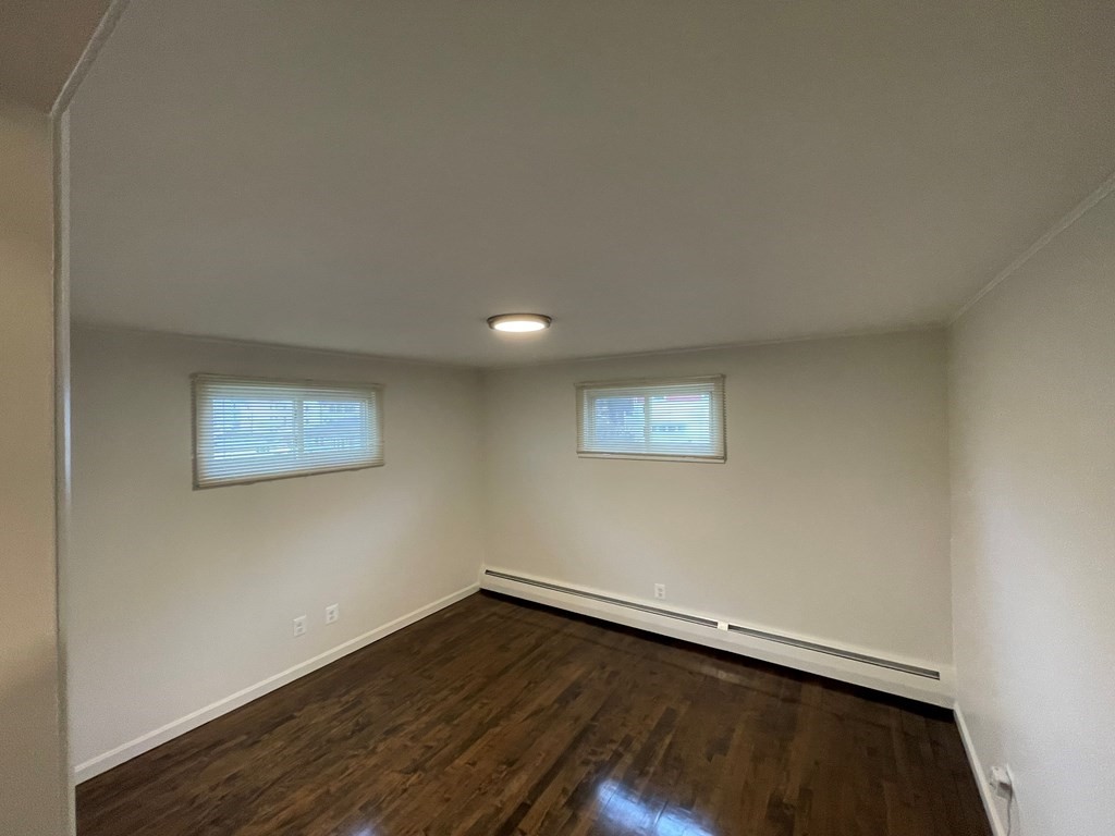40 Dillon Street Worcester, MA 01604 - Photo 15 of 23 a view of an empty room with wooden floor and a window