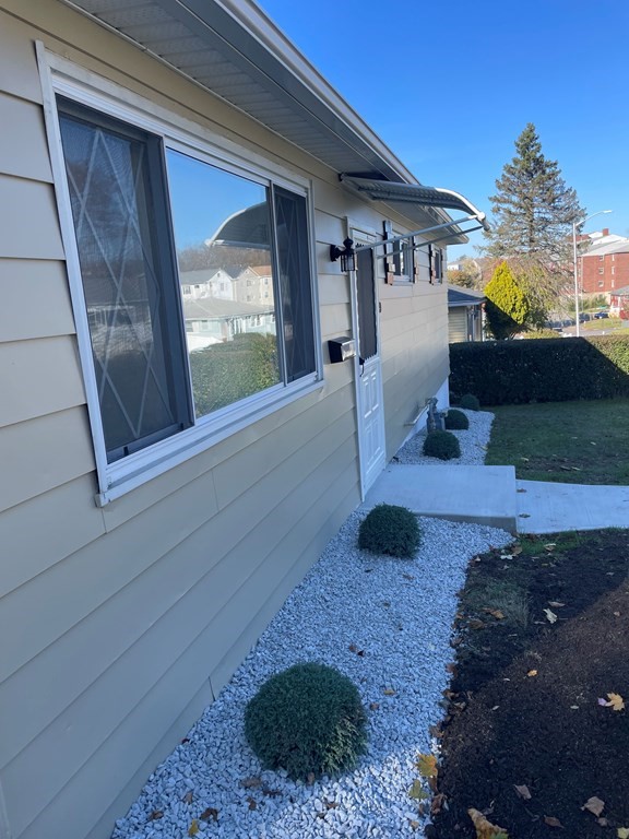 40 Dillon Street Worcester, MA 01604 - Photo 4 of 23 a living room with furniture and a floor to ceiling window