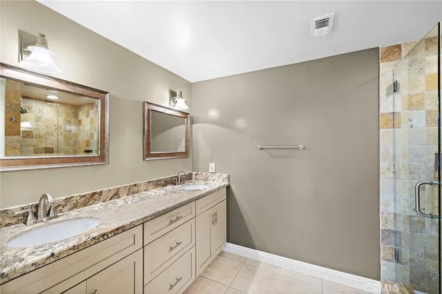 a bathroom with a shower and a sink