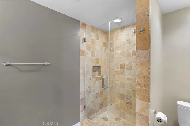 an empty room with fan and windows