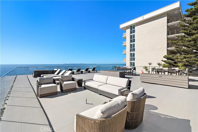 a balcony with furniture and a potted plant