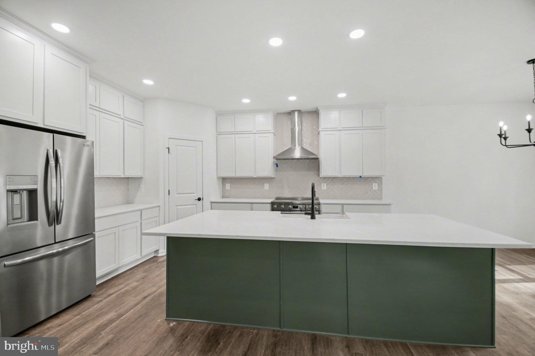 7253 Blackwell Road Warrenton, VA 20187 - Photo 15 of 41 Sleek modern kitchen with island charm.