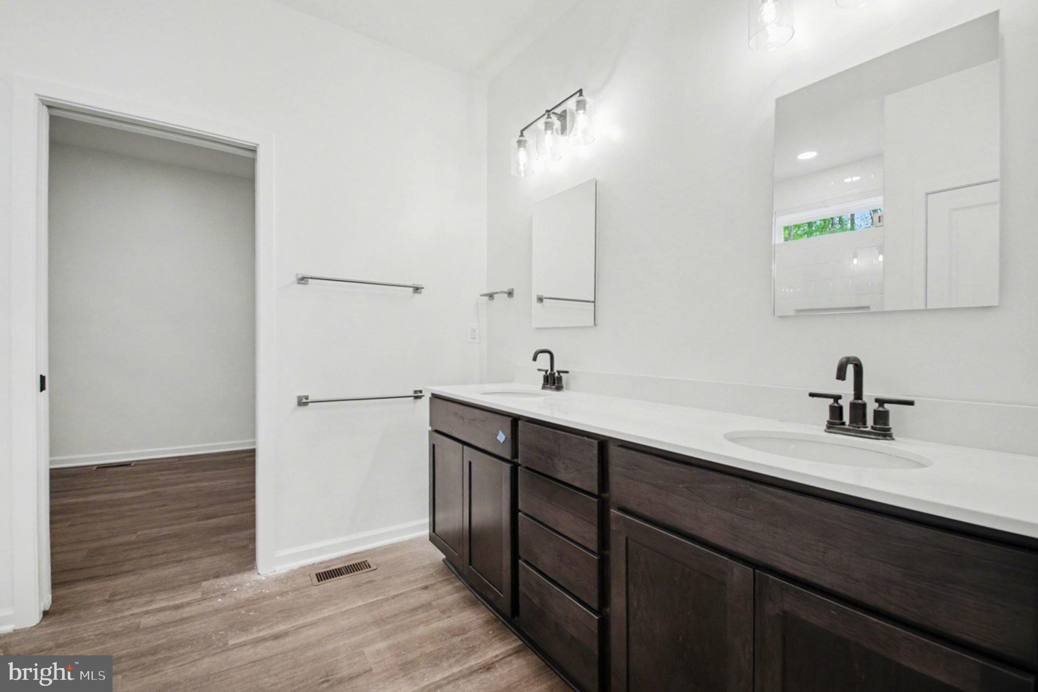 7253 Blackwell Road Warrenton, VA 20187 - Photo 28 of 41 Sleek modern bathroom with dual sinks.