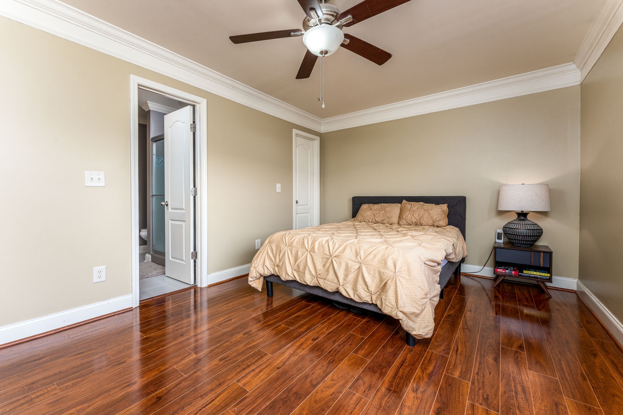 735 Tulip Grove Road, Unit 210 Hermitage, TN 37076 - Photo 14 of 32 a bedroom with a bed and wooden floor