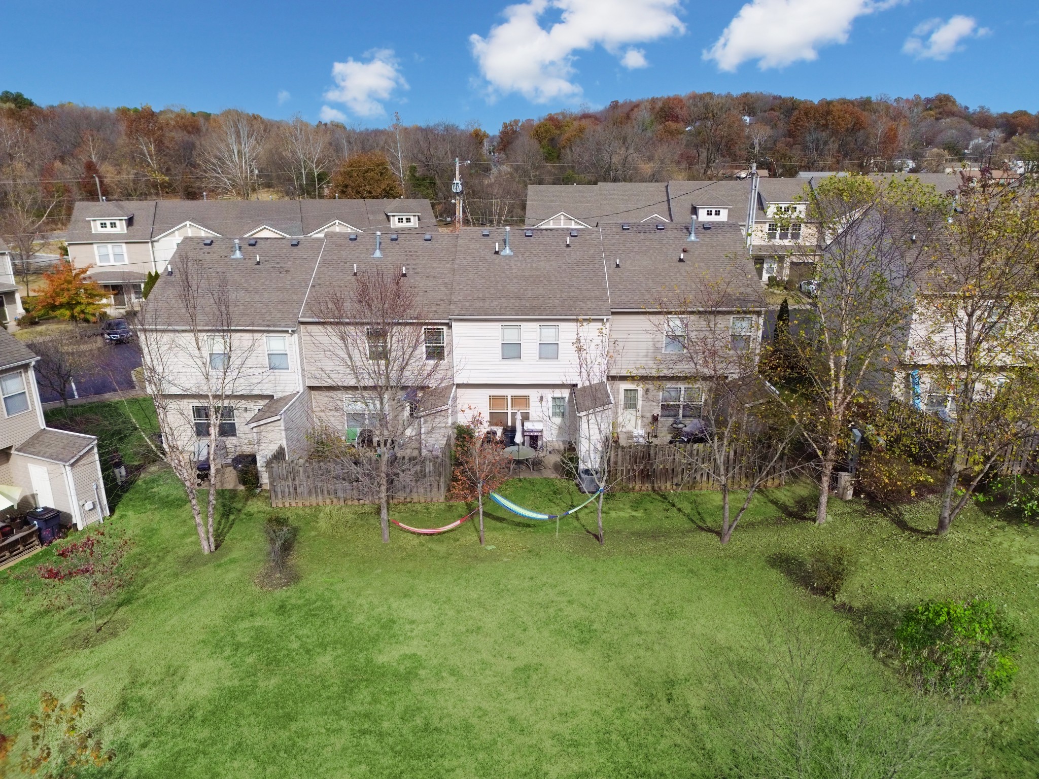 735 Tulip Grove Road, Unit 210 Hermitage, TN 37076 - Photo 27 of 32 an aerial view of residential houses with outdoor space and trees