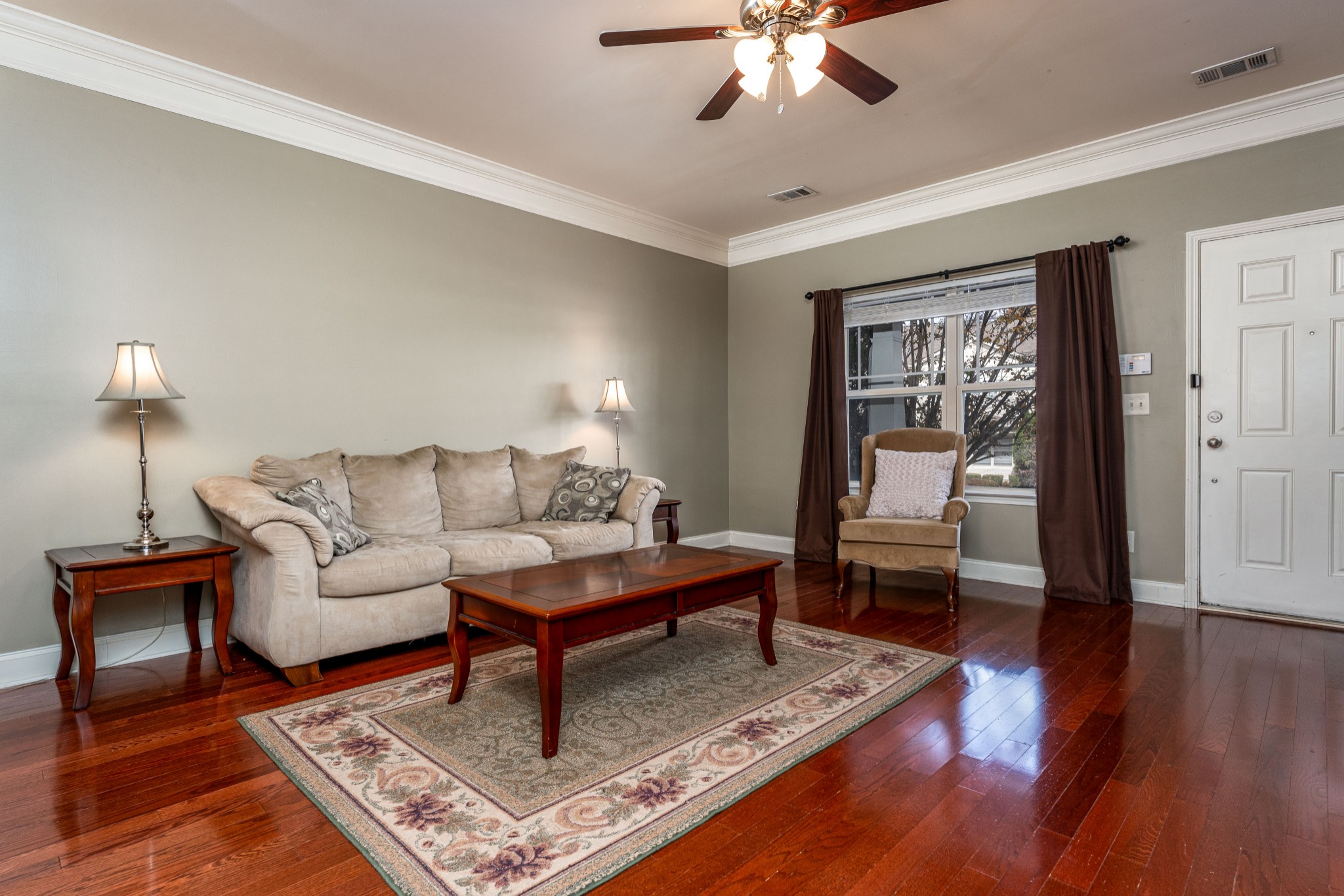 735 Tulip Grove Road, Unit 210 Hermitage, TN 37076 - Photo 7 of 32 a living room with furniture and a wooden floor