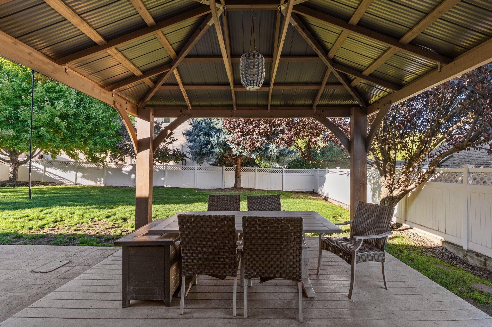 878 Ridgeview Drive Eagle Point, OR 97524 - Photo 27 of 39 a view of a backyard with table and chairs with a barbeque grill and plants