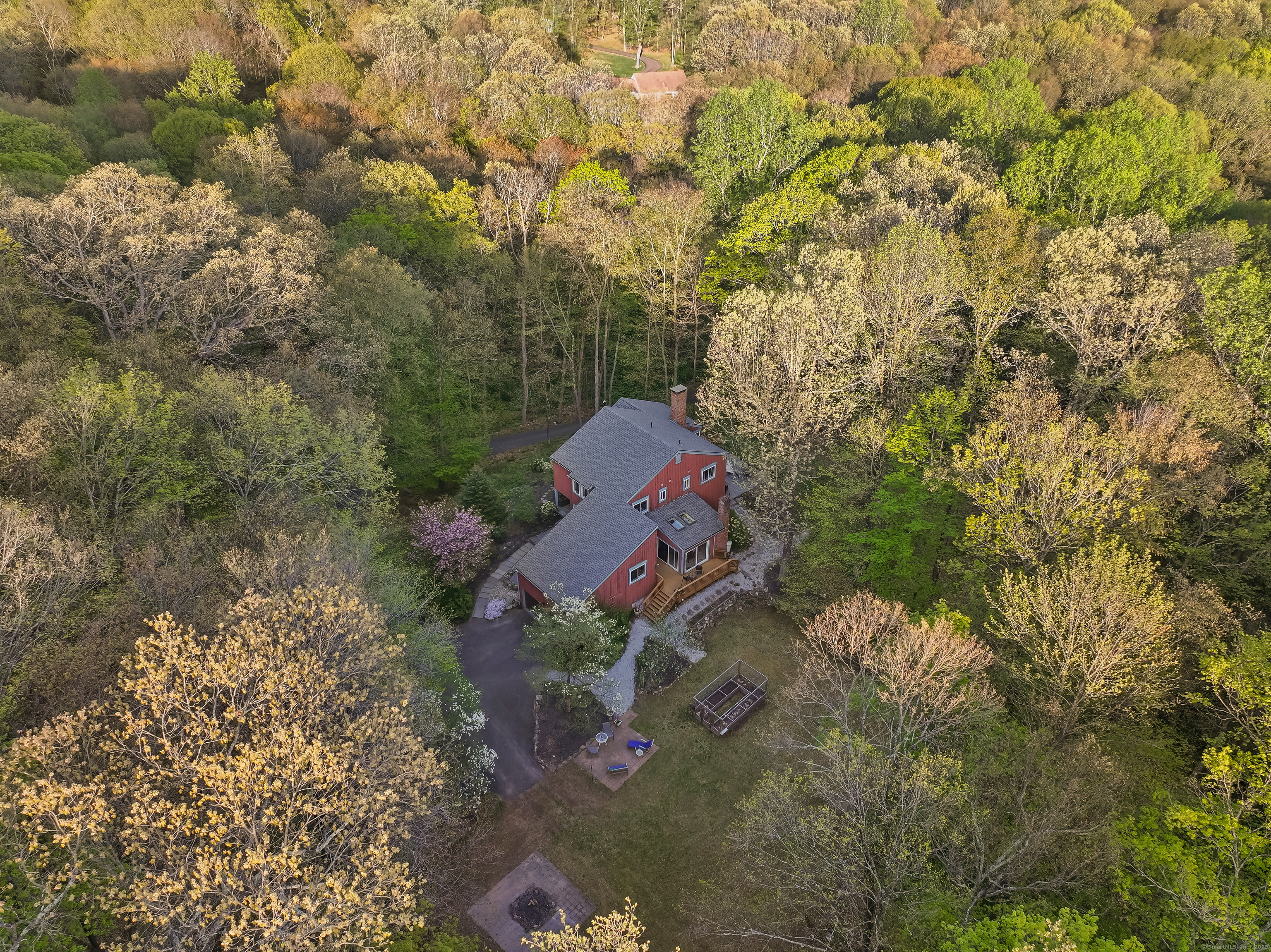 14 Parsons Lane Redding, CT 06896 - Photo 1 of 1 a backyard of a house with a yard and outdoor seating