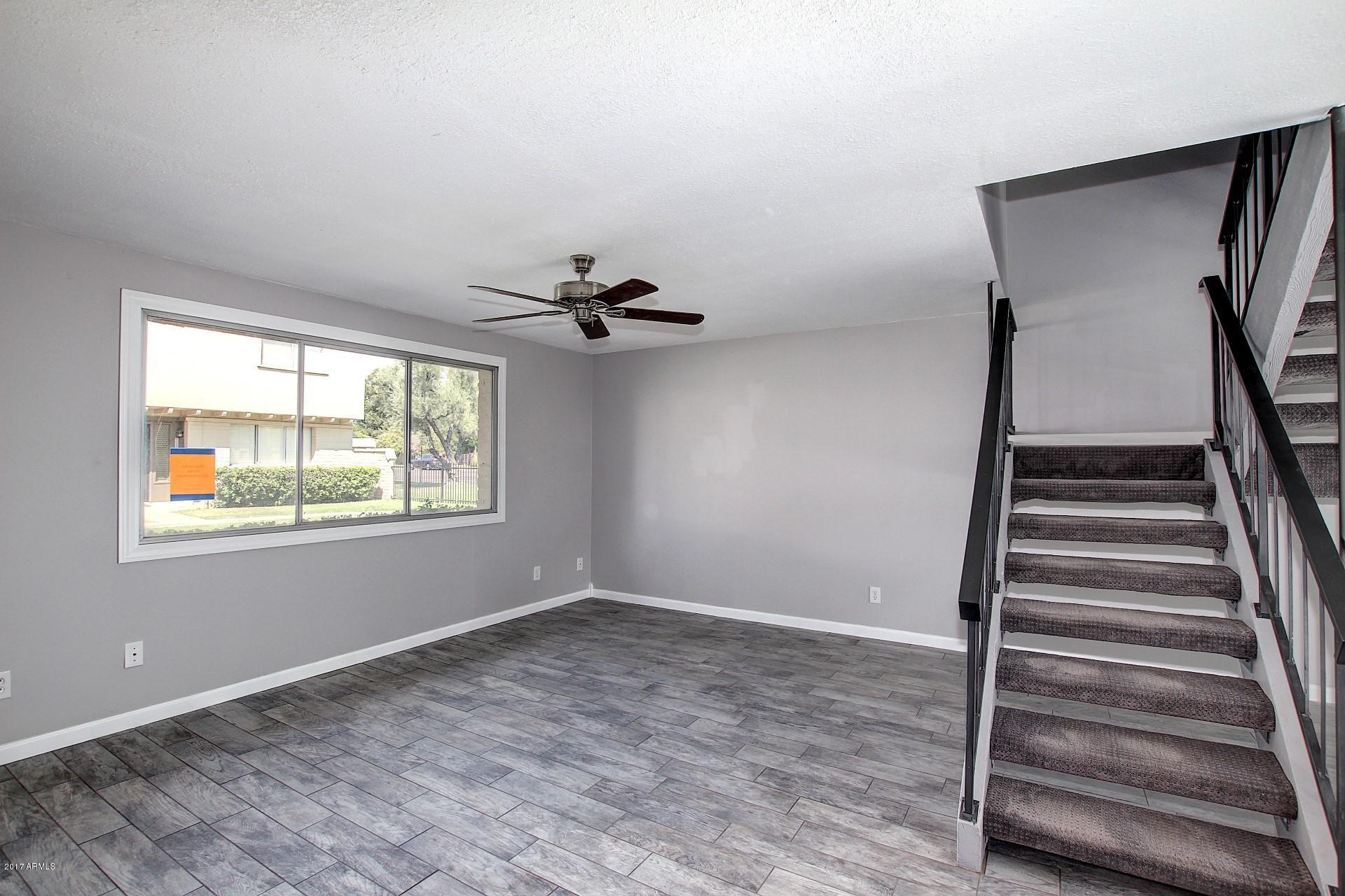 6909 East Osborn Road, Unit F Scottsdale, AZ 85251 - Photo 11 of 55 a view of an empty room with a window
