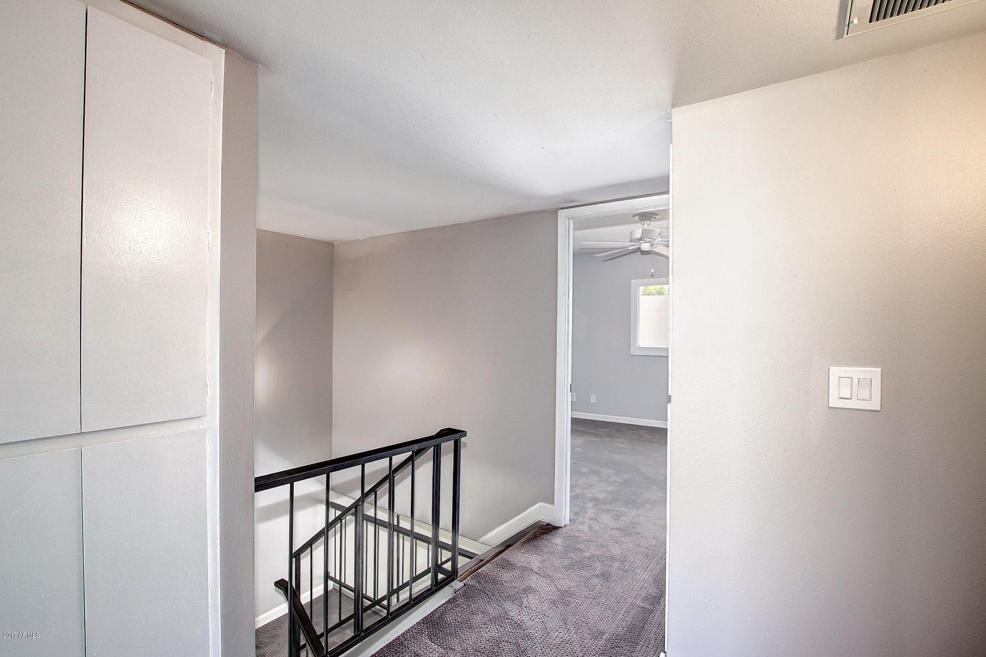 6909 East Osborn Road, Unit F Scottsdale, AZ 85251 - Photo 16 of 55 a view of hallway with stairs