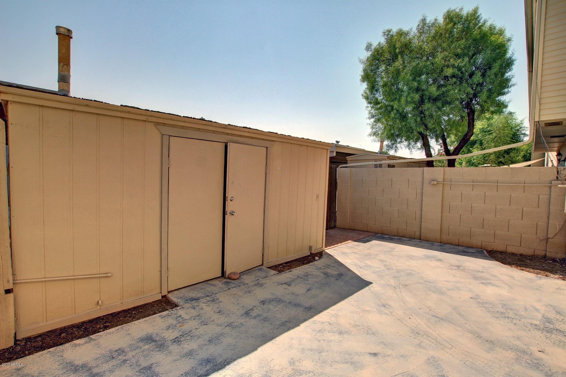 6909 East Osborn Road, Unit F Scottsdale, AZ 85251 - Photo 29 of 55 a backyard of a house