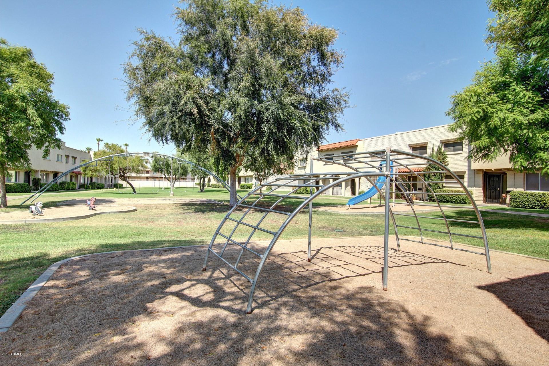 6909 East Osborn Road, Unit F Scottsdale, AZ 85251 - Photo 35 of 55 a view of a park with swings