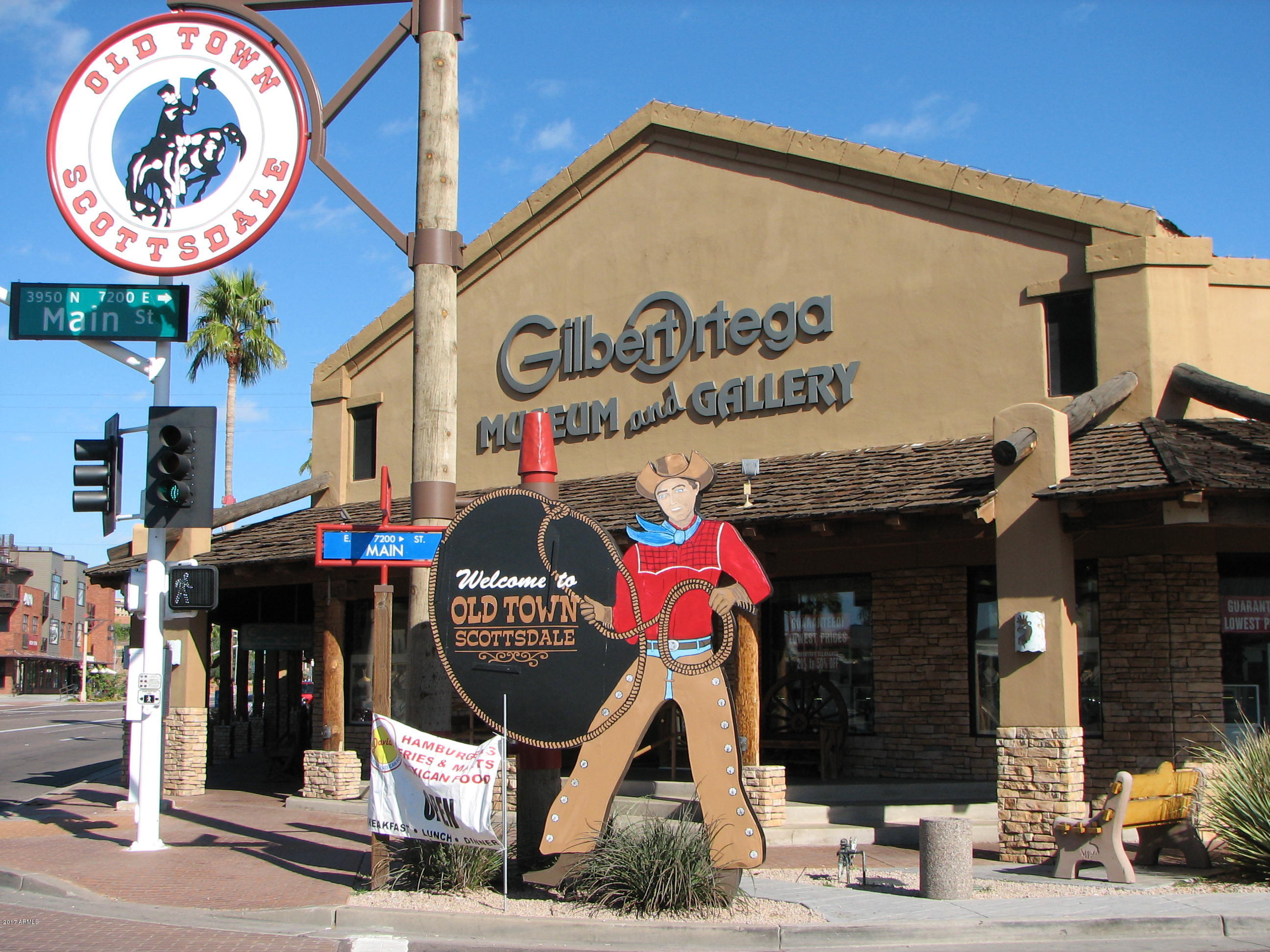 6909 East Osborn Road, Unit F Scottsdale, AZ 85251 - Photo 44 of 55 a view of a cafe with a table and chairs