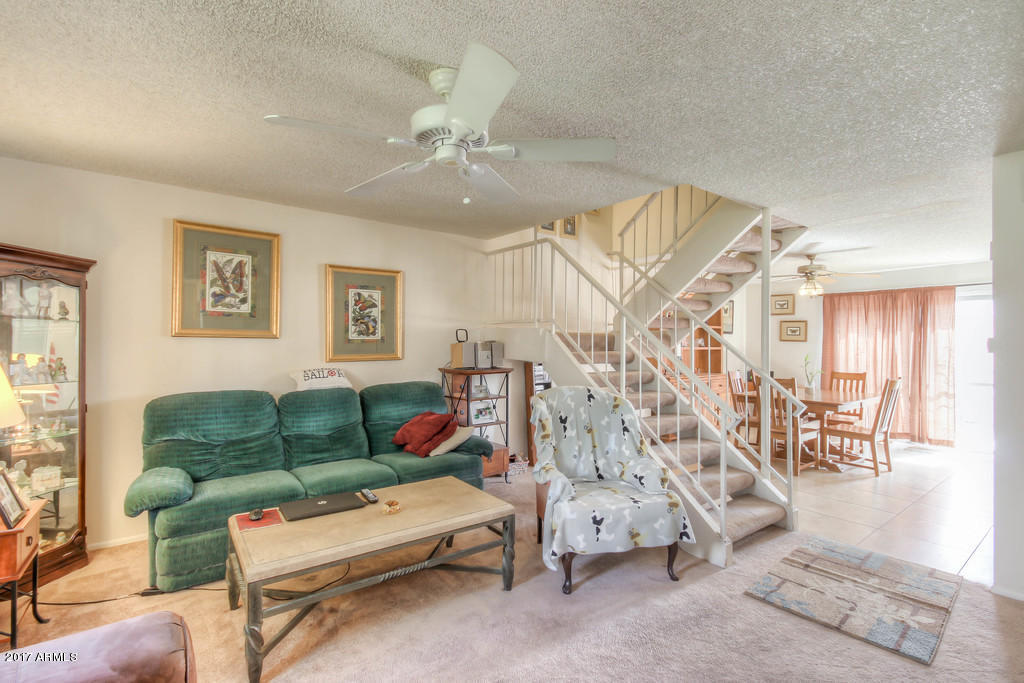 6909 East Osborn Road, Unit F Scottsdale, AZ 85251 - Photo 52 of 55 a living room with furniture and wooden floor