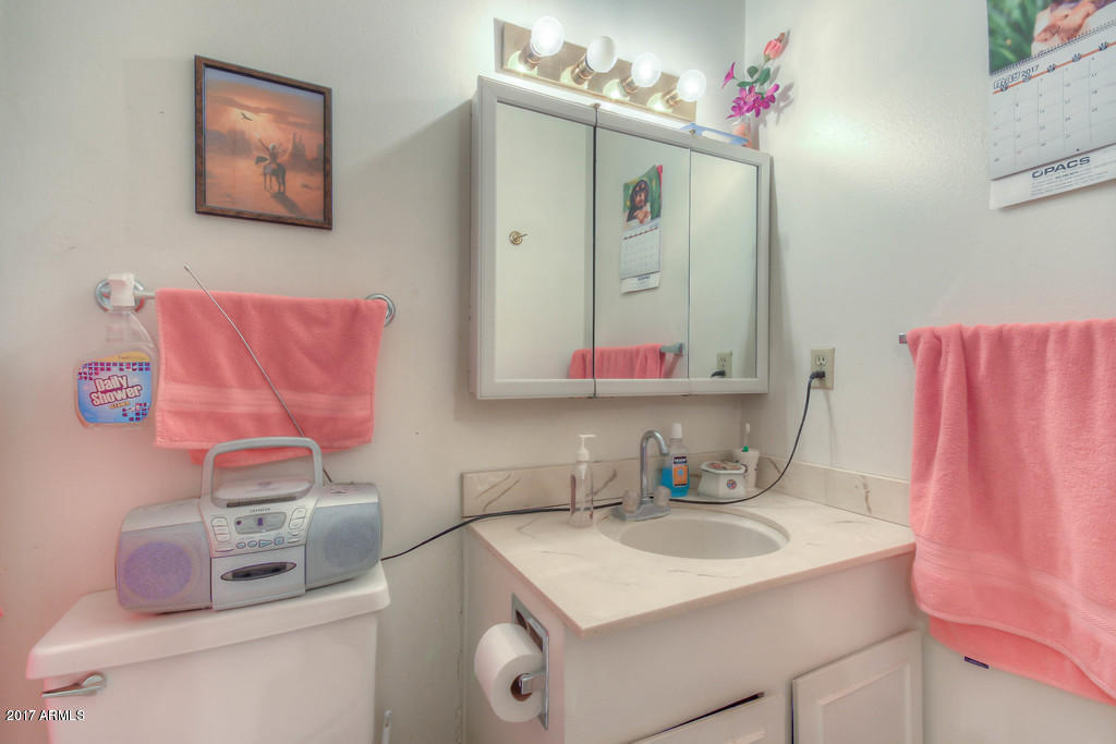 6909 East Osborn Road, Unit F Scottsdale, AZ 85251 - Photo 55 of 55 a bathroom with a sink vanity mirror and vanity
