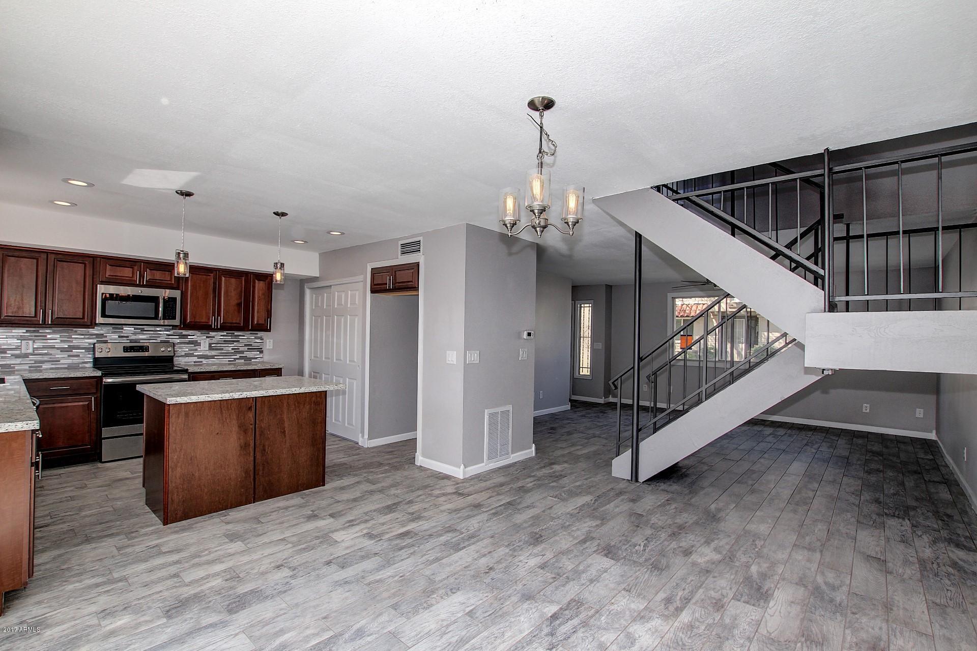 6909 East Osborn Road, Unit F Scottsdale, AZ 85251 - Photo 6 of 55 a view of kitchen with furniture and wooden floor