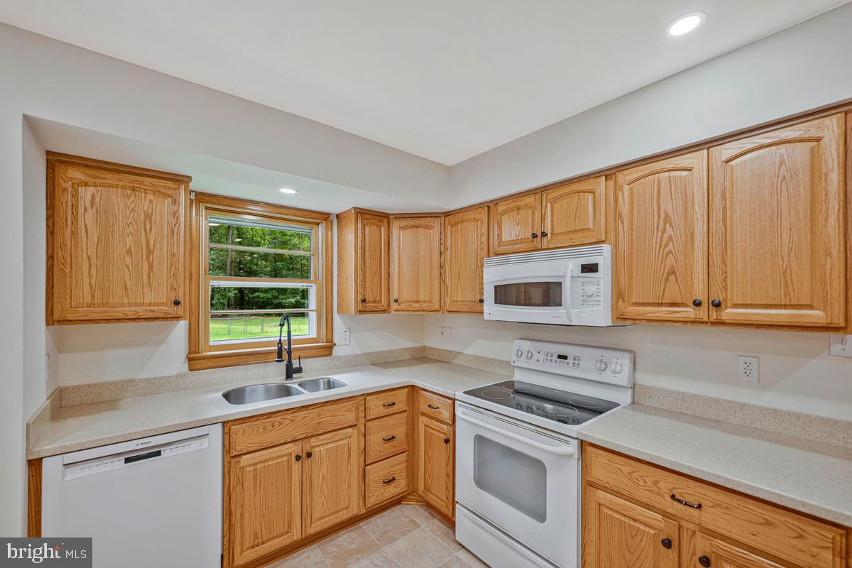 7185 Hawthorne Road La Plata, MD 20646 - Photo 19 of 59 Bright kitchen with oak cabinetry.
