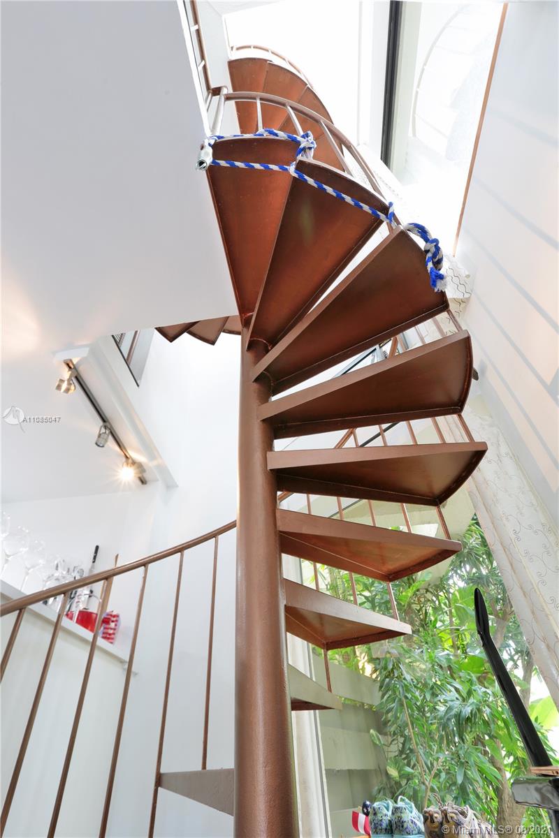 3034 Southwest 27th Avenue, Unit 4 Miami, FL 33133 - Photo 7 of 15 a view of an entryway with staircase