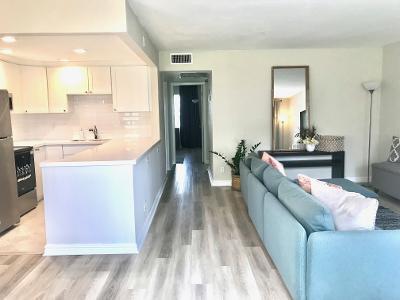 517 Fanshaw M Boca Raton, FL 33434 - Photo 2 of 11 a living room with stainless steel appliances kitchen island granite countertop wooden floor and a sink