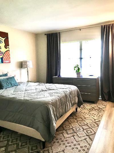 517 Fanshaw M Boca Raton, FL 33434 - Photo 8 of 11 a bedroom with a bed and a window
